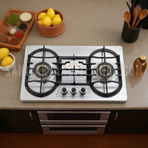 Gas Stove RINO RS959B,"Stainless steel kitchen stove with three burners and control knobs, illuminated by overhead lighting,