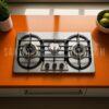 Gas Stove RINO RS959,"Stainless steel kitchen stove with three burners and control knobs, illuminated by overhead lighting,
