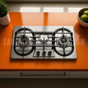 Gas Stove RINO RS959,"Stainless steel kitchen stove with three burners and control knobs, illuminated by overhead lighting,