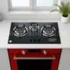 Gas Stove RINO RS939, "Stainless steel kitchen stove with three burners and control knobs, illuminated by overhead lighting,
